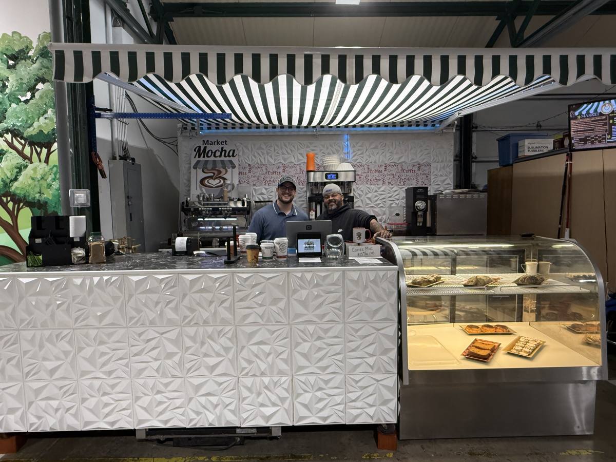Market Mocha stall with green-and-white awning and pastry case